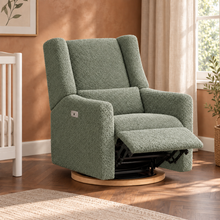 Kiwi Luxe sage bouclé recliner with footrest extended in nursery